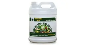 White plastic container with green and white label for 'Toloue Mazrae Talaie' liquid fertilizer designed for agricultural use.